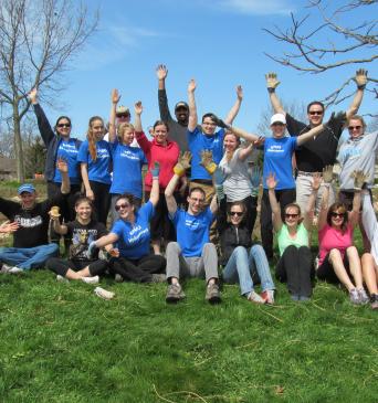 KPMG group celebrating being outside volunteering